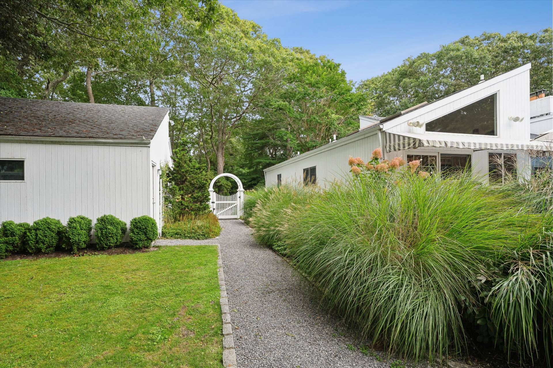 25 Midhampton Avenue Quogue, NY 11959 - Photo 13 of 32 a backyard of a house with seating space