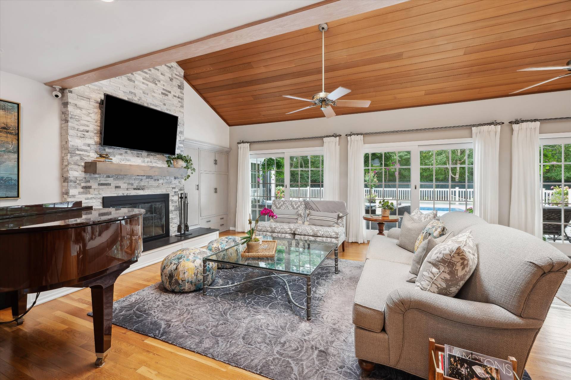 25 Midhampton Avenue Quogue, NY 11959 - Photo 14 of 32 a living room with fireplace furniture and a flat screen tv