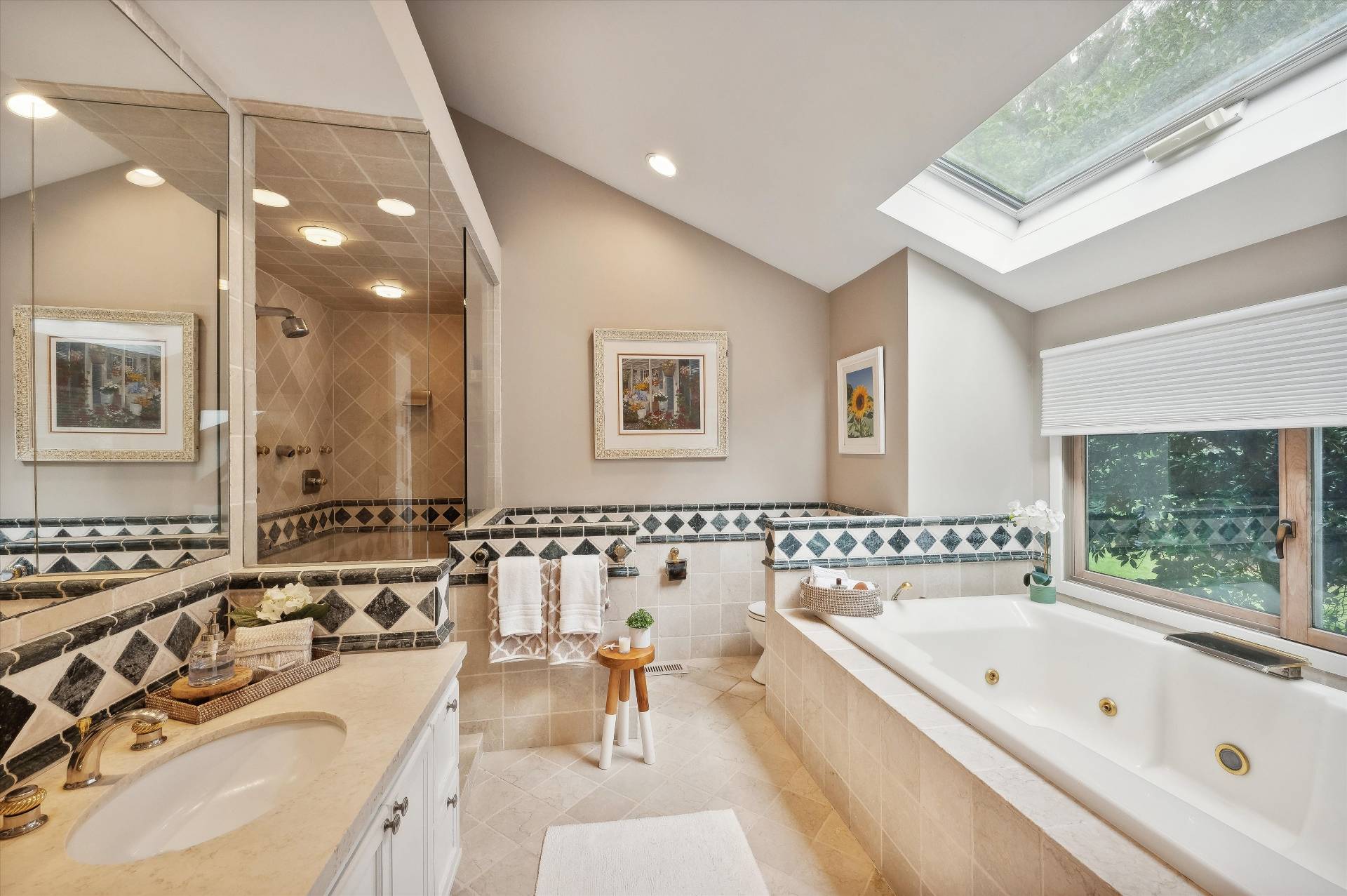 25 Midhampton Avenue Quogue, NY 11959 - Photo 26 of 32 a bathroom with a tub a double vanity sink and mirror