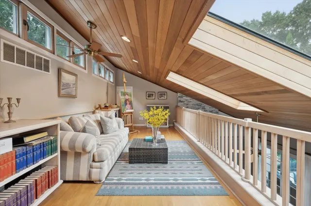 a view of a balcony with furniture