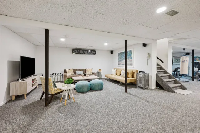 a bedroom with furniture and a flat screen tv