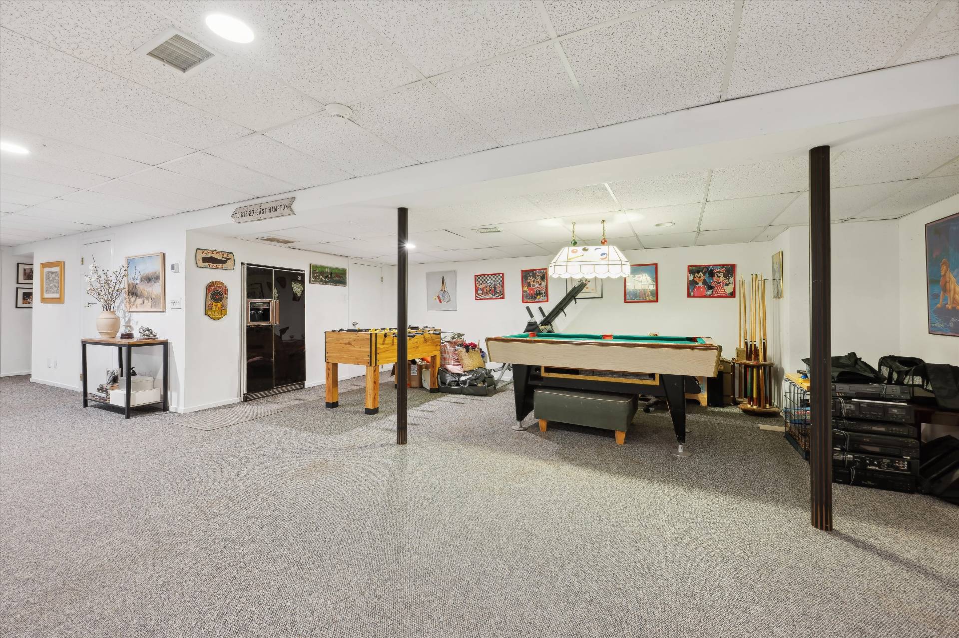 25 Midhampton Avenue Quogue, NY 11959 - Photo 32 of 32 a living room with furniture and a table