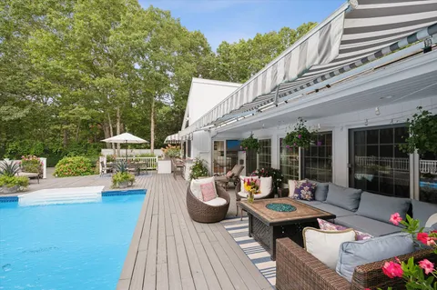a outdoor space with patio the couches and a dining table with garden view