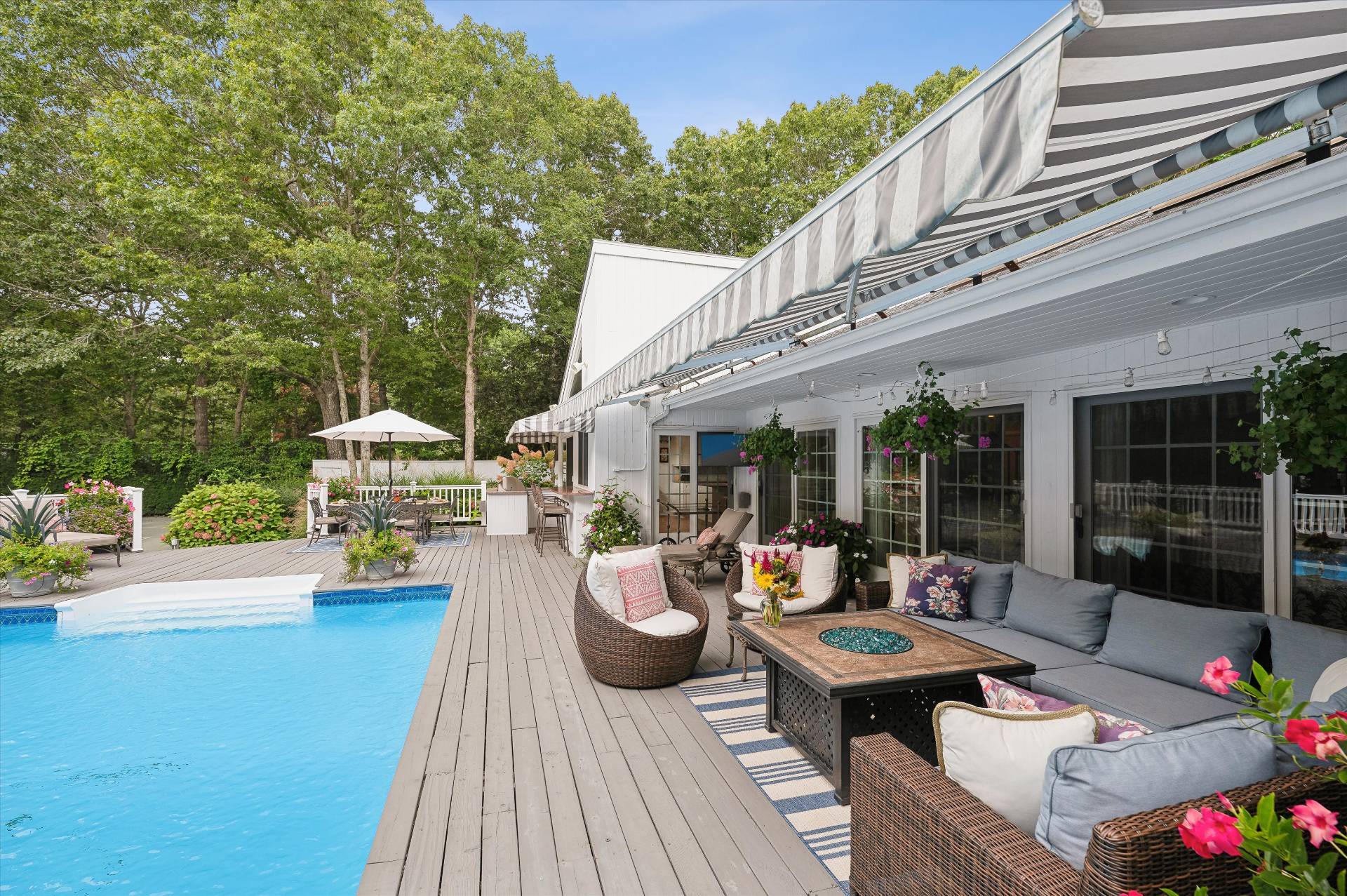 25 Midhampton Avenue Quogue, NY 11959 - Photo 4 of 32 a outdoor space with patio the couches and a dining table with garden view