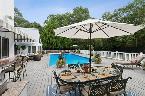 an outdoor space with furniture and umbrella