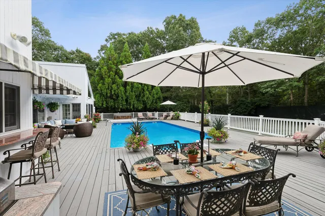 an outdoor space with furniture and umbrella