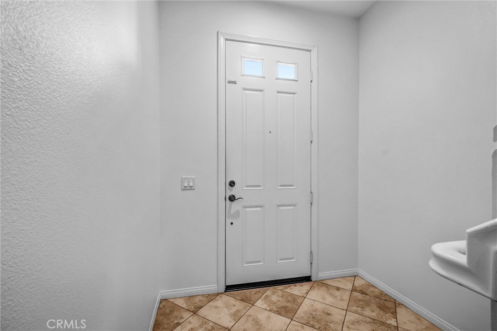 12 Shellprint Court Newport Beach, CA 92663 - Photo 7 of 42 Front Entry Door with access to downstairs Office or stairway to main level.