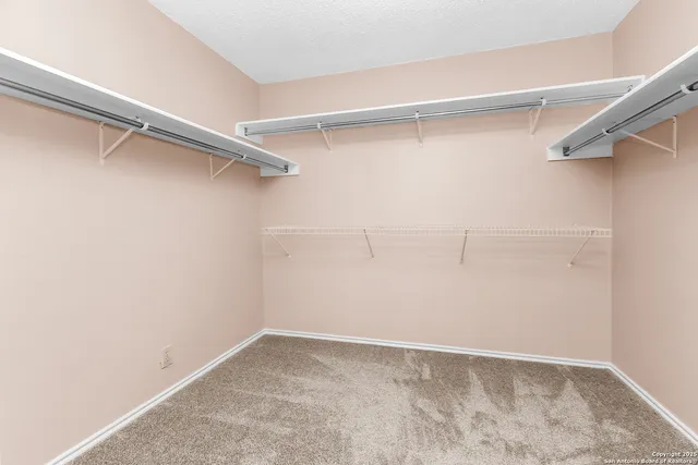 a view of backyard with deck and garden