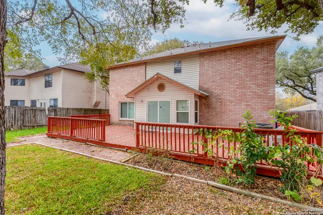 a view of a backyard with tree