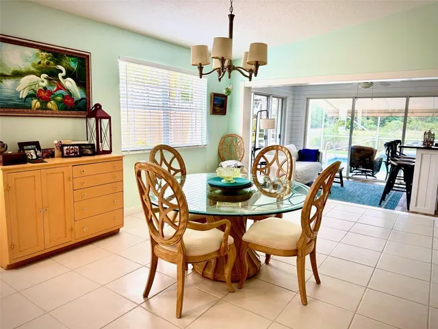 a dining room filled with furniture and window