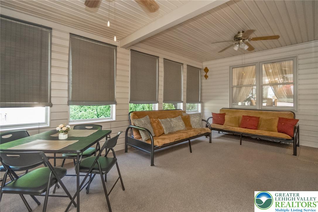 2298 Yost Road Bath, PA 18014 - Photo 31 of 33 A relaxed sunroom offers abundant natural light and versatile space for dining and lounging.