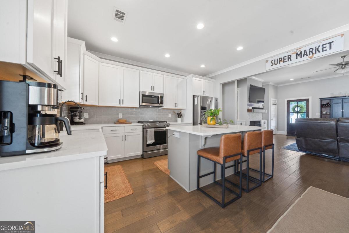 757 Markhams Drive Madison, GA 30650 - Photo 22 of 46 a kitchen with a sink a counter top space and appliances