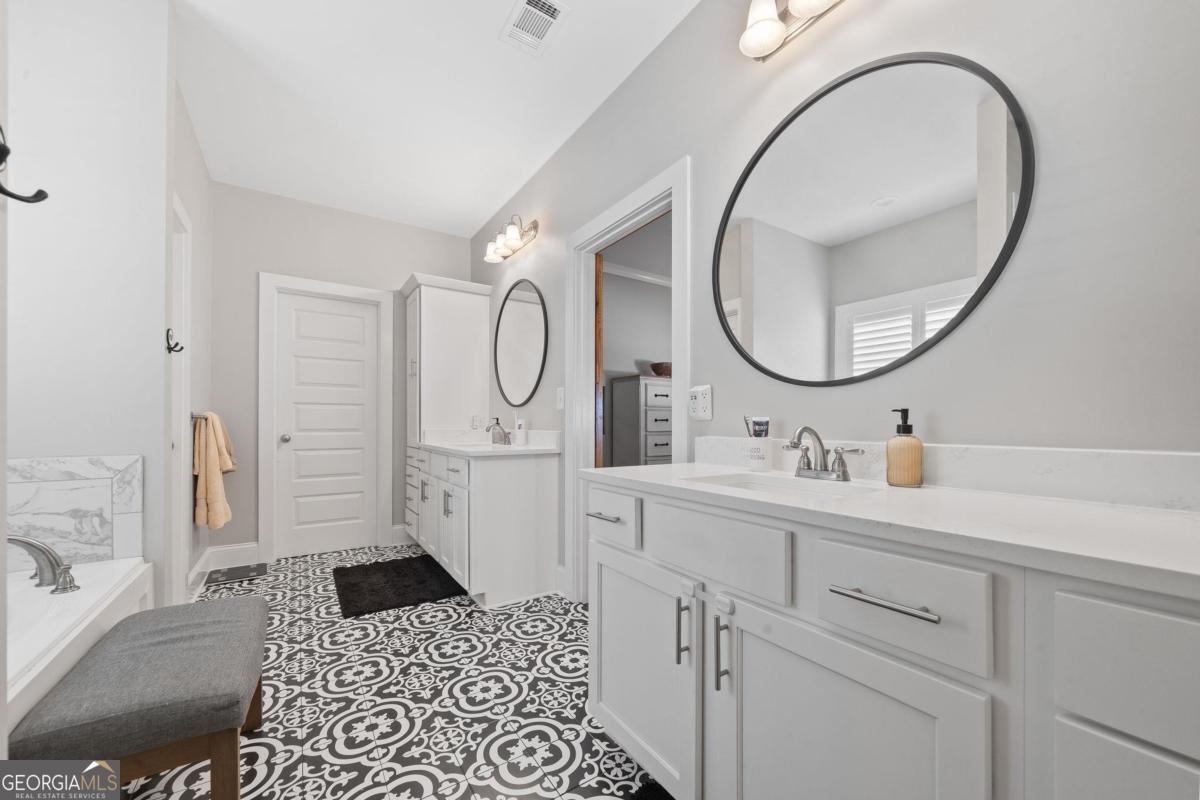 757 Markhams Drive Madison, GA 30650 - Photo 29 of 46 a bathroom with a sink a toilet and a mirror