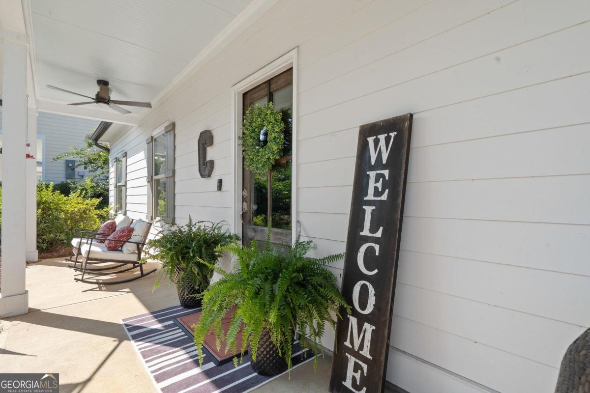 757 Markhams Drive Madison, GA 30650 - Photo 3 of 46 a view of sign board with potted plants