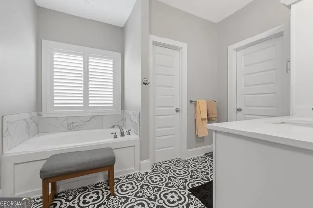 a bathroom with a bathtub and a sink