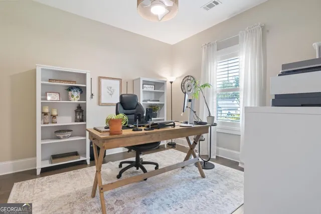 a view of a workspace with furniture