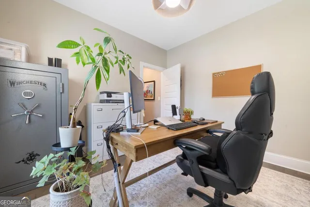 a view of a workspace with furniture