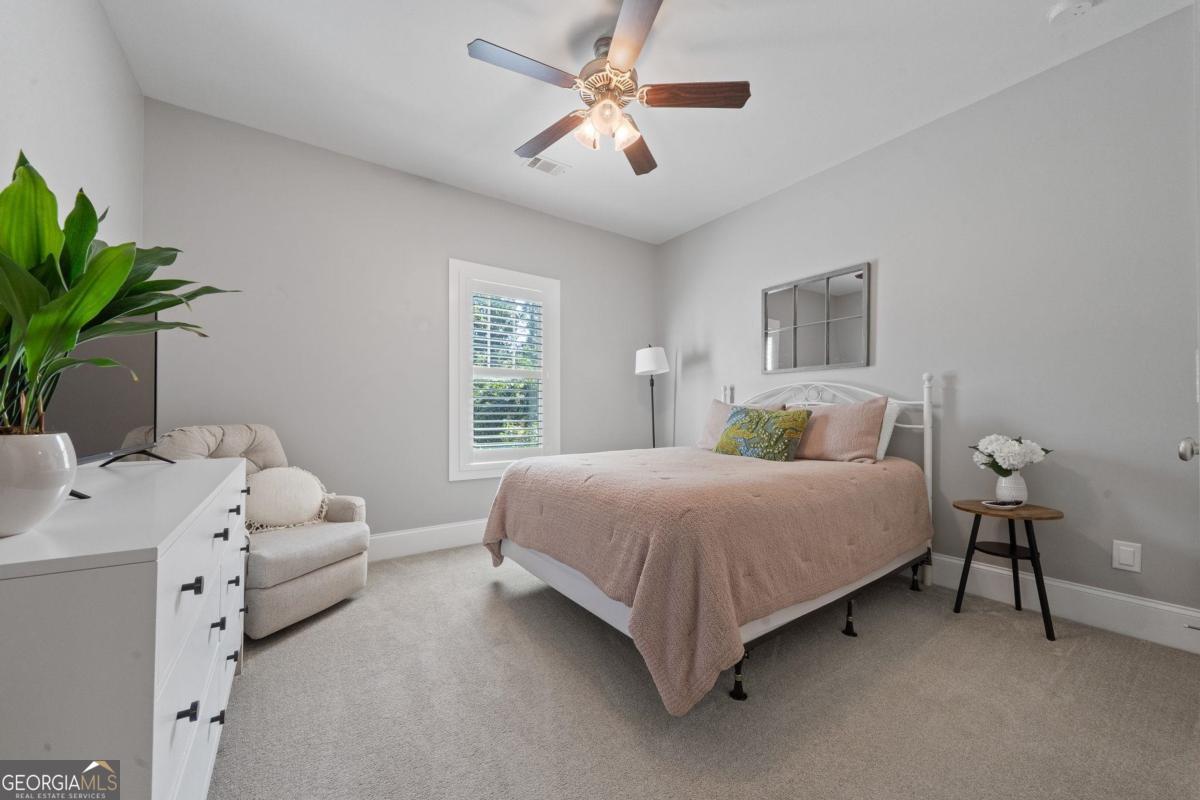 757 Markhams Drive Madison, GA 30650 - Photo 37 of 46 a bedroom with a bed furniture and a window