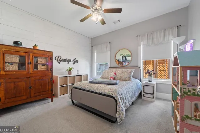 a bed room with a bed and a chandelier