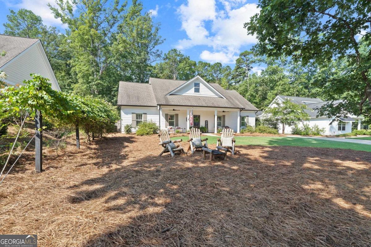 757 Markhams Drive Madison, GA 30650 - Photo 7 of 46 a view of a house with backyard porch and sitting area