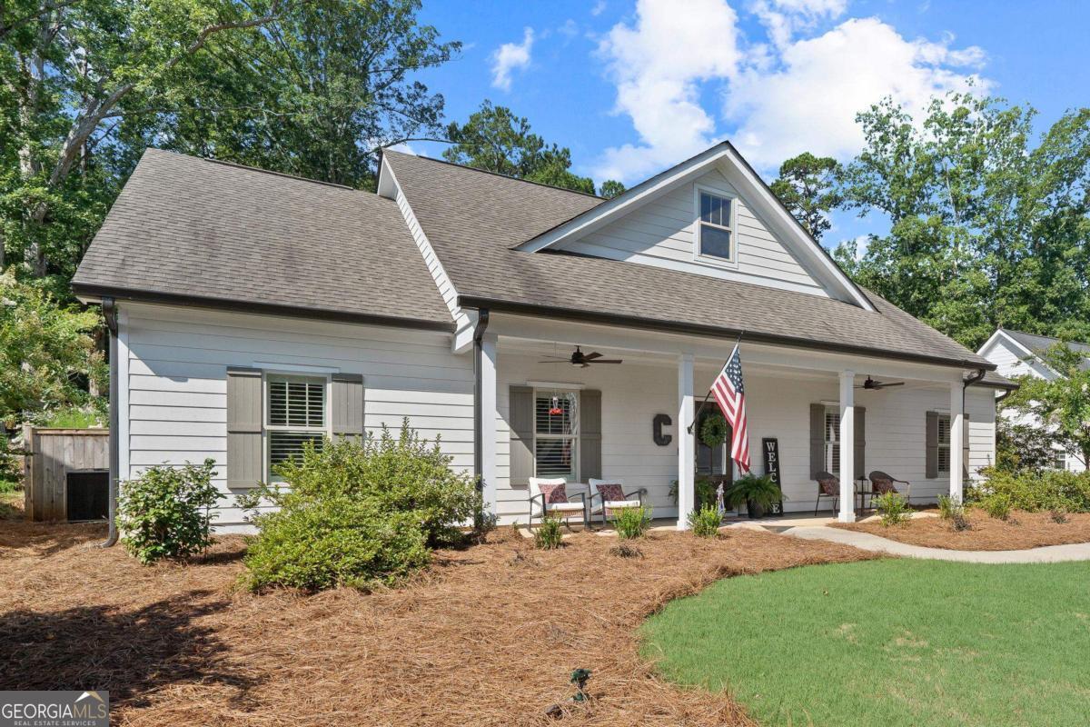 757 Markhams Drive Madison, GA 30650 - Photo 9 of 46 a view of a house with yard and plants