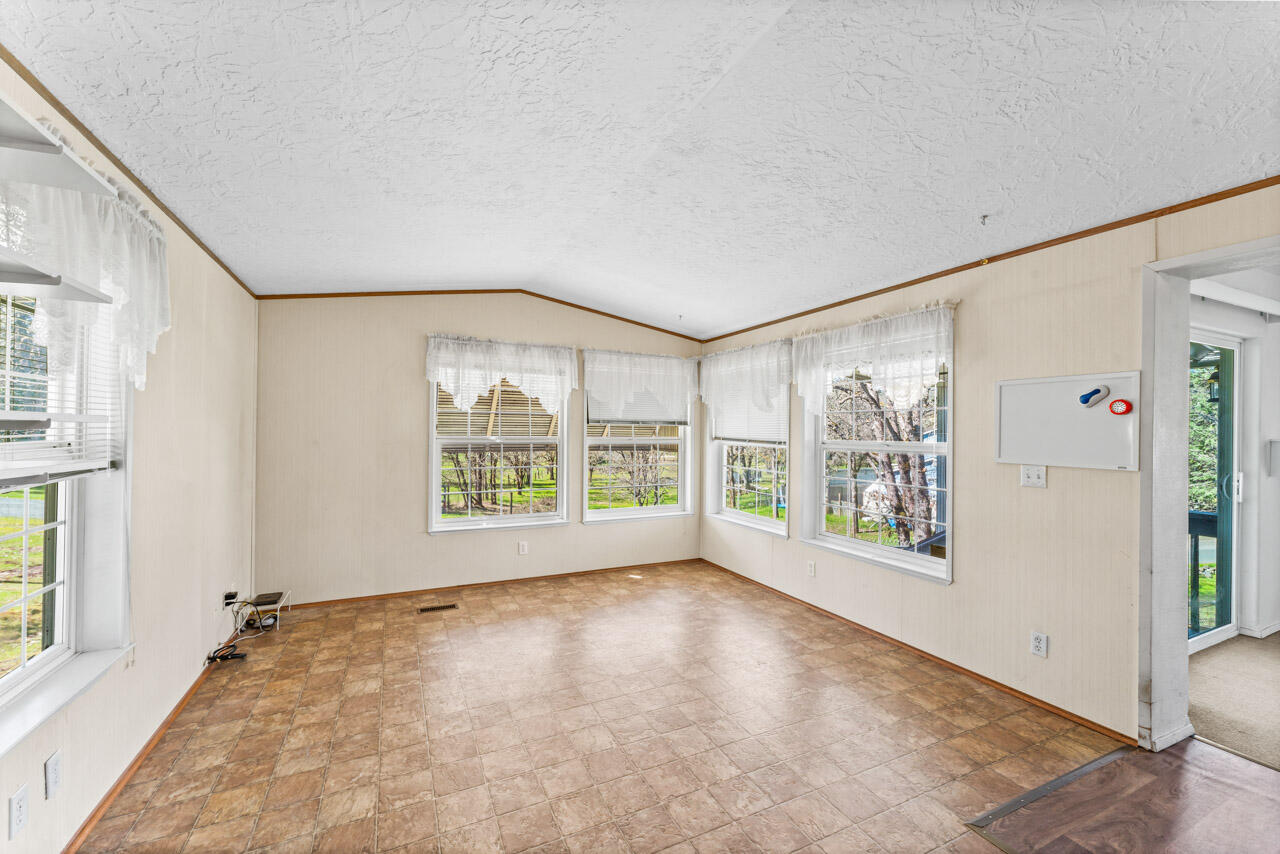 650 Three Pines Road Grants Pass, OR 97526 - Photo 15 of 48 a view of an empty room with a window