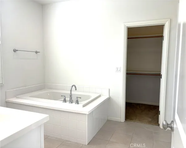 a bathroom with a sink a vanity and window