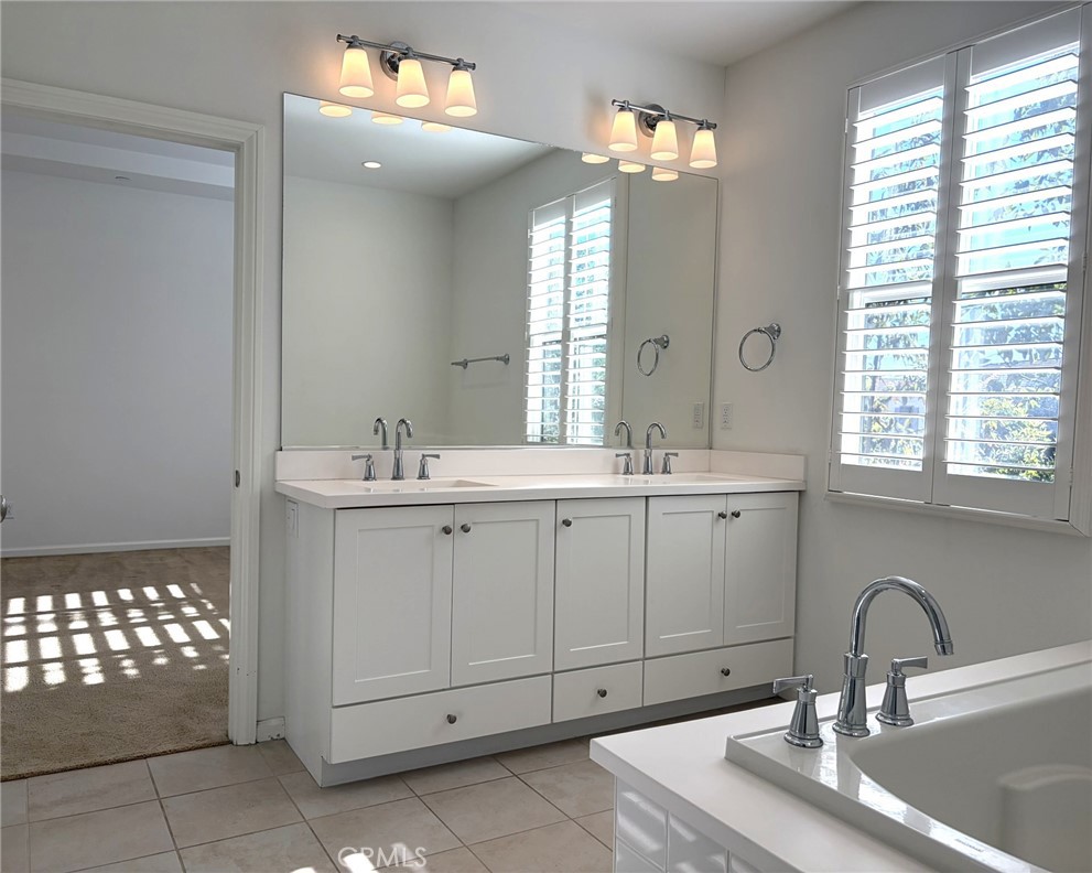 178 Working Ranch Irvine, CA 92602 - Photo 16 of 42 a bathroom with a sink a vanity and window