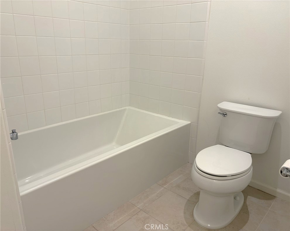 178 Working Ranch Irvine, CA 92602 - Photo 22 of 42 a white toilet sitting next to a bath tub