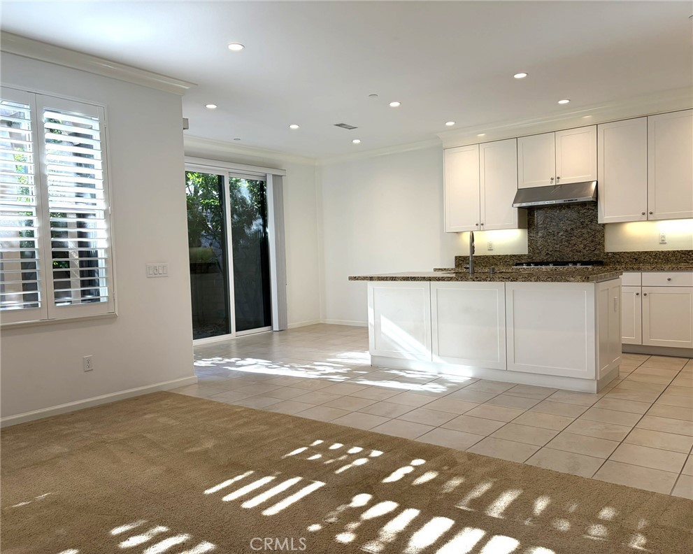 178 Working Ranch Irvine, CA 92602 - Photo 4 of 42 a view of a kitchen with granite countertop a sink and a stove