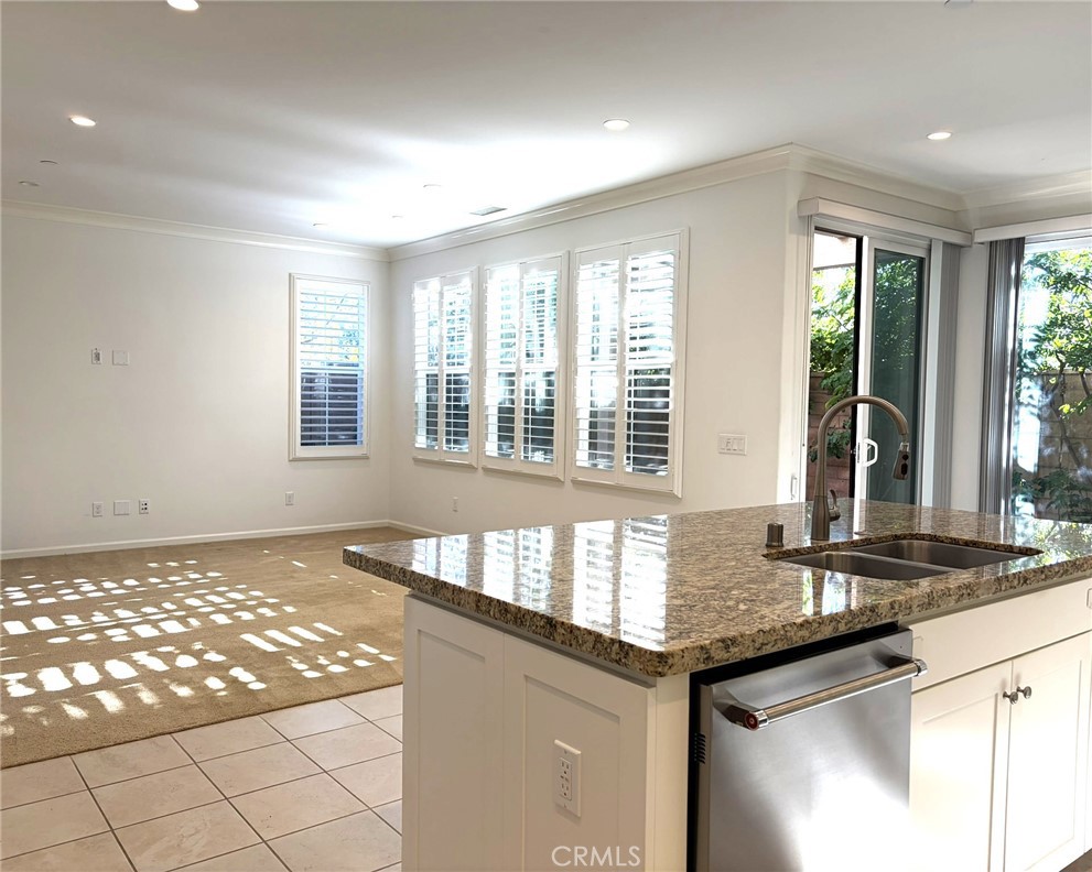 178 Working Ranch Irvine, CA 92602 - Photo 5 of 42 a kitchen with granite countertop sink and window