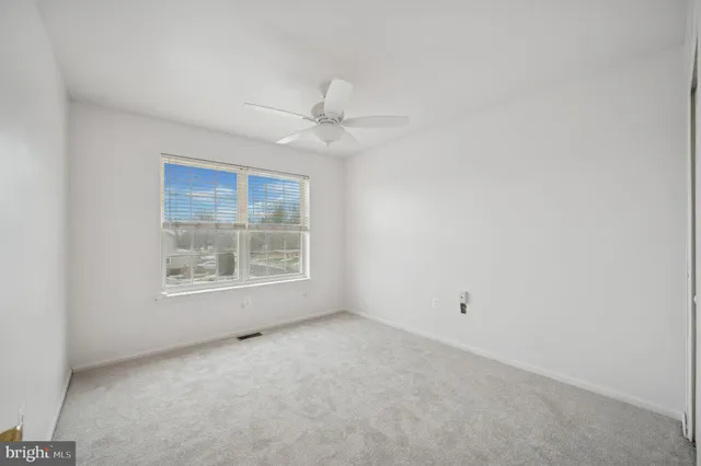 a spacious bathroom with a double vanity sink a mirror and a bathtub