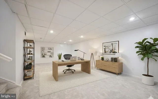 a view of an empty room with a fireplace