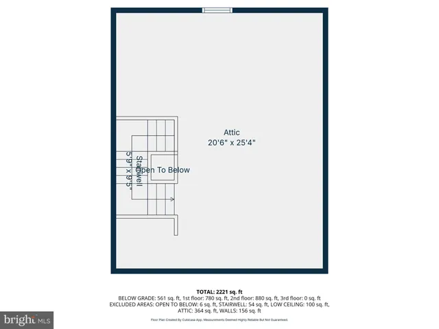 a view of a room with wooden floor and windows