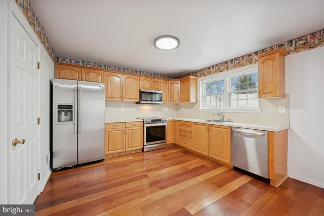 a view of a livingroom with a fireplace and cabinet