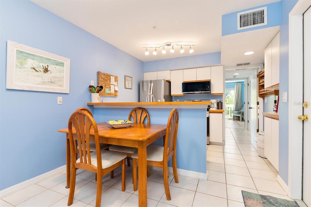 9400 Little Gasparilla, Unit H2 Placida, FL 33946 - Photo 11 of 47 a view of a dining room with furniture