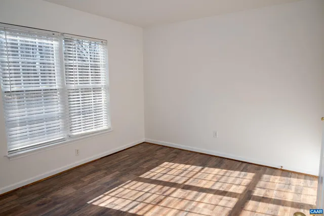 a view of backyard with deck and wooden floor