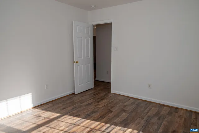 a view of backyard with deck and wooden floor