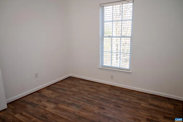 a bathroom with a toilet a sink and a mirror