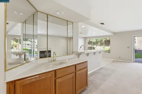 a kitchen with sink and window