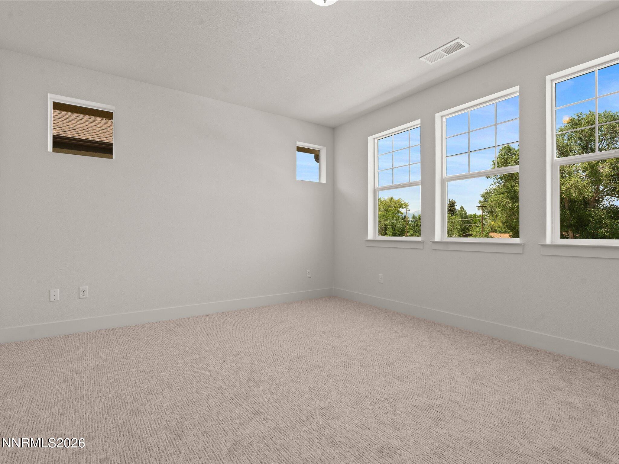 1371 Vine Gate Road, Unit HOMESITE 49 Carson City, NV 89701 - Photo 9 of 24 a view of an empty room with a window