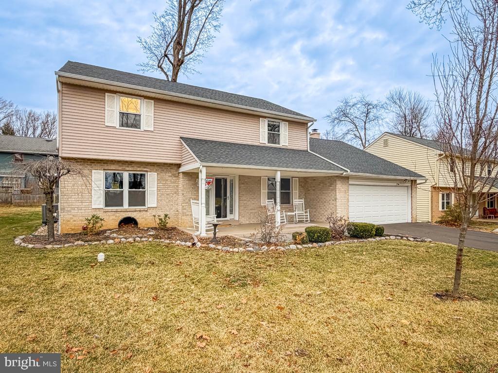a front view of house with yard outdoor seating and barbeque oven
