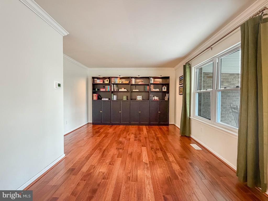 738 Bridgeview Road Feasterville-Trevose, PA 19053 - Photo 13 of 54 a view of an empty room with a window and wooden floor