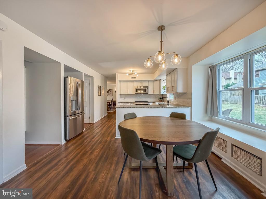 738 Bridgeview Road Feasterville-Trevose, PA 19053 - Photo 20 of 54 a dining room with furniture a chandelier and wooden floor