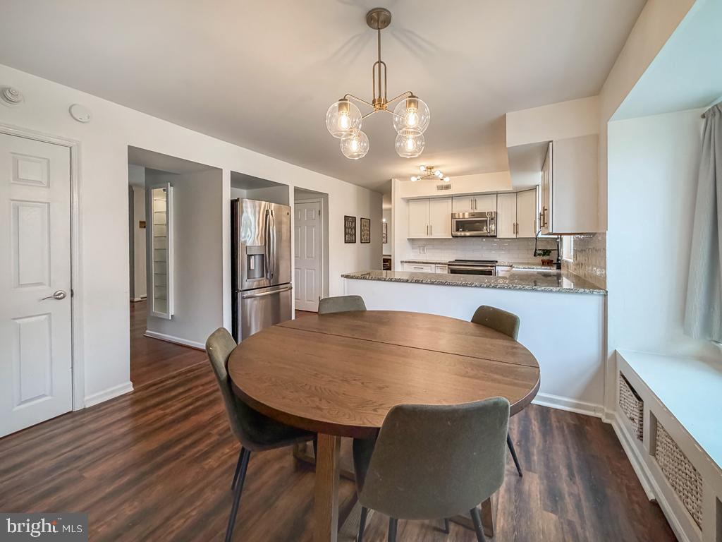 738 Bridgeview Road Feasterville-Trevose, PA 19053 - Photo 21 of 54 a view of a dining room with furniture and wooden floor