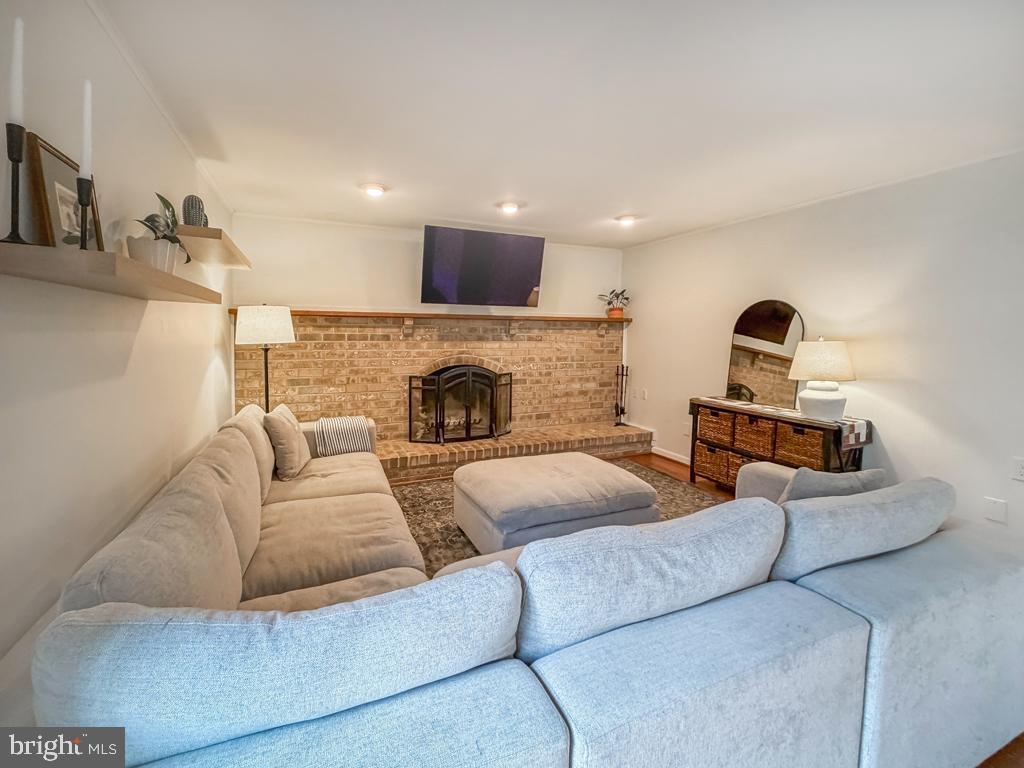 738 Bridgeview Road Feasterville-Trevose, PA 19053 - Photo 25 of 54 a living room with furniture and a fireplace