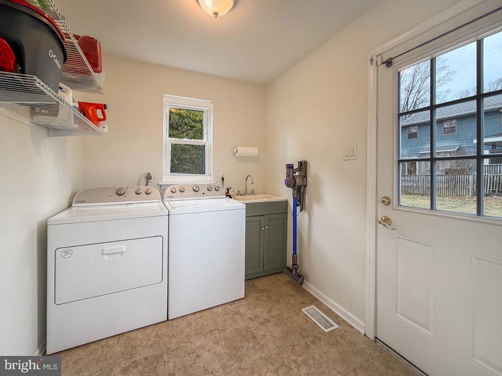 738 Bridgeview Road Feasterville-Trevose, PA 19053 - Photo 29 of 54 a utility room with dryer and washer