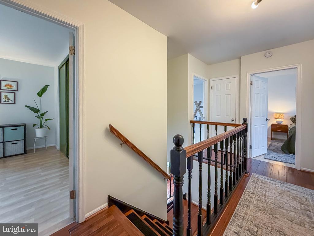 738 Bridgeview Road Feasterville-Trevose, PA 19053 - Photo 31 of 54 a view of a hallway with wooden floor and stairs