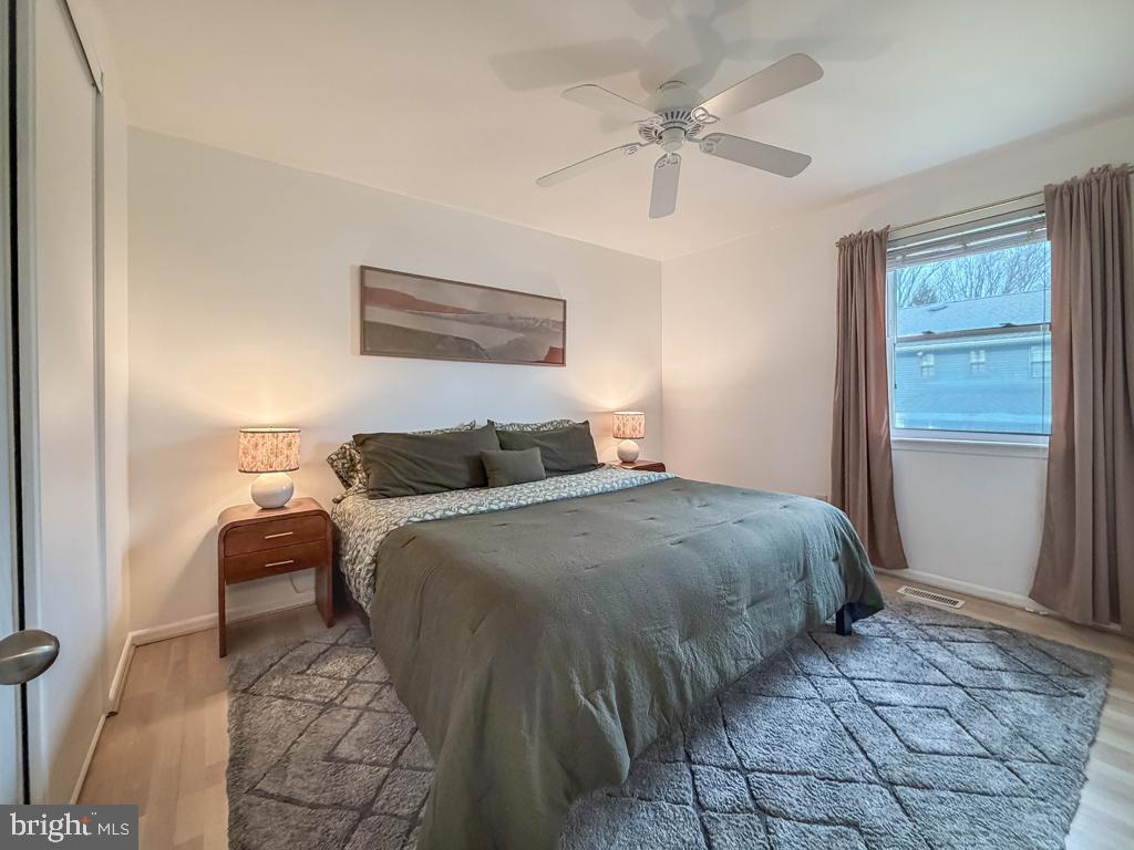 738 Bridgeview Road Feasterville-Trevose, PA 19053 - Photo 42 of 54 a bedroom with a bed and a ceiling fan