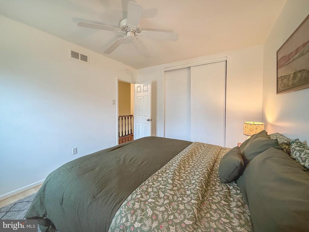 738 Bridgeview Road Feasterville-Trevose, PA 19053 - Photo 43 of 54 a bedroom with a bed and a chandelier
